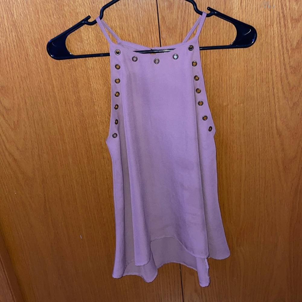 Tank top with cut out lines with metal rings